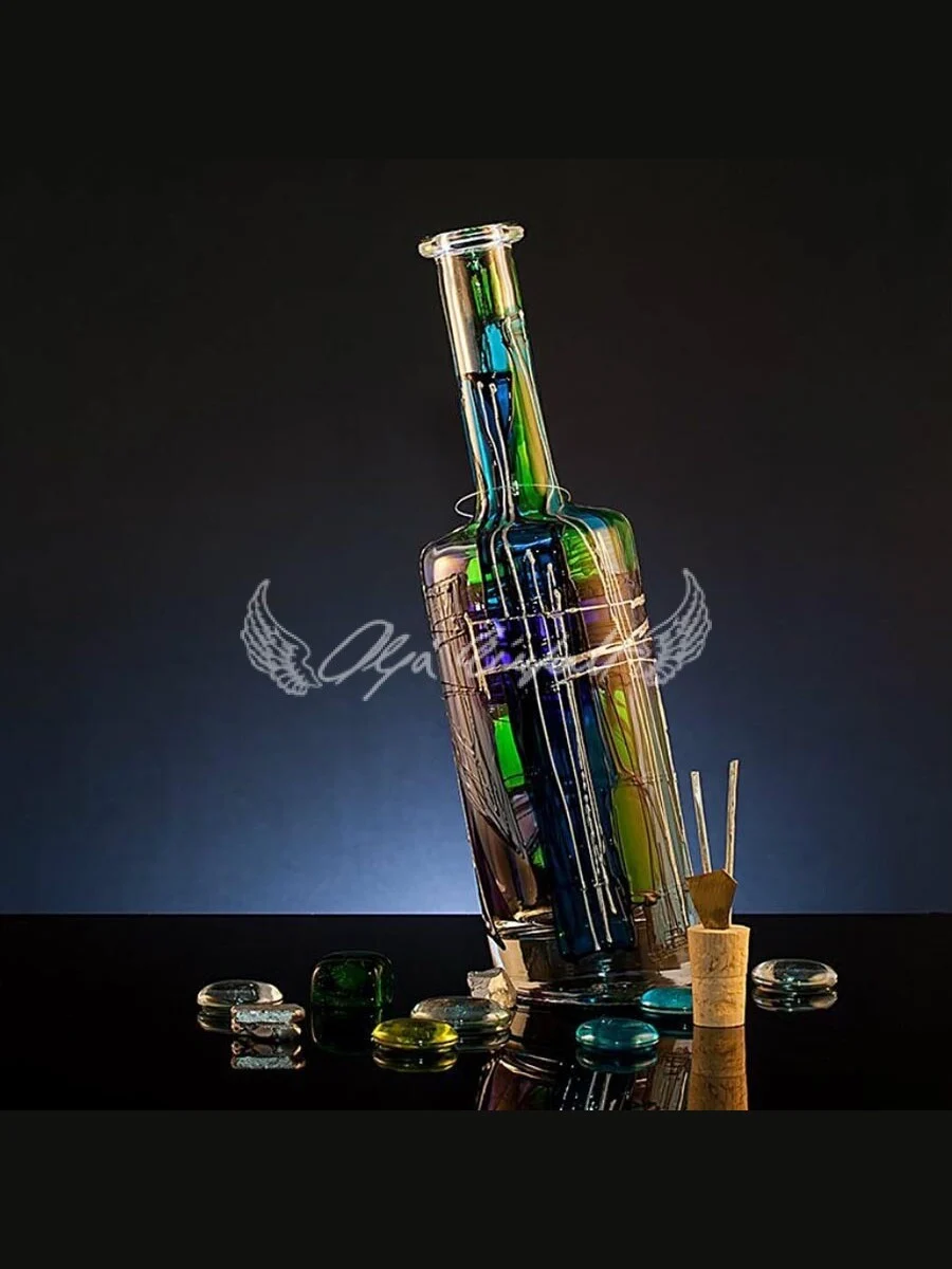 Emerald Edition handmade glass bottle in deep shifting green tones