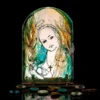 Hand painted glass icon of Our Lady with gentle expression and warm glow
