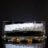 Noir Harbour hand painted glass panel with abstract harbour skyline in black and gold