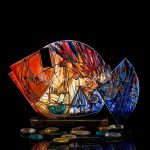 Solaris Rift giant hand painted glass fish with crimson and emerald flares over blue