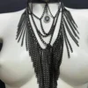 Vampirica Black statement necklace with cascading golden chains and central pendant