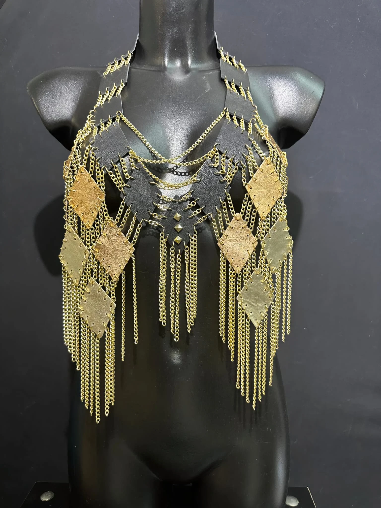 Cosmo Solaris black leather top with layered gold chain fringe