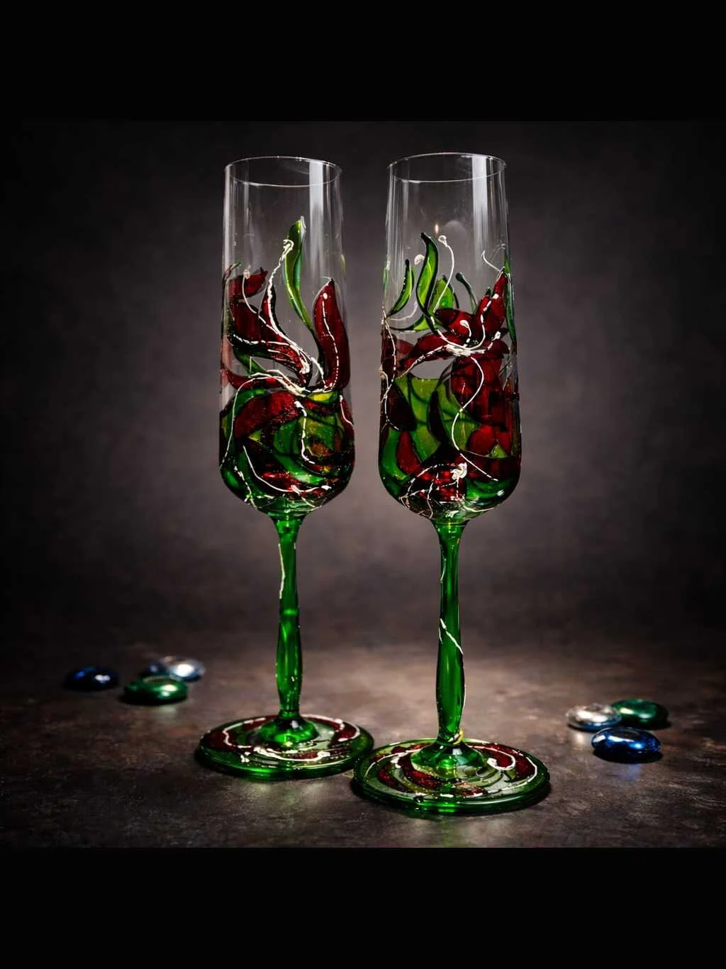 Verdant Kiss set of two hand painted champagne glasses in ruby red and vivid green