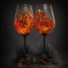 Ember Nocturne set of two hand painted wine glasses in amber with black lines and gold accents
