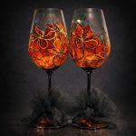 Ember Nocturne set of two hand painted wine glasses in amber with black lines and gold accents