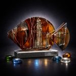 Amber Core glass fish sculpture with hand painted geometric lines and glowing amber center