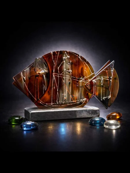 Amber Core glass fish sculpture with hand painted geometric lines and glowing amber center