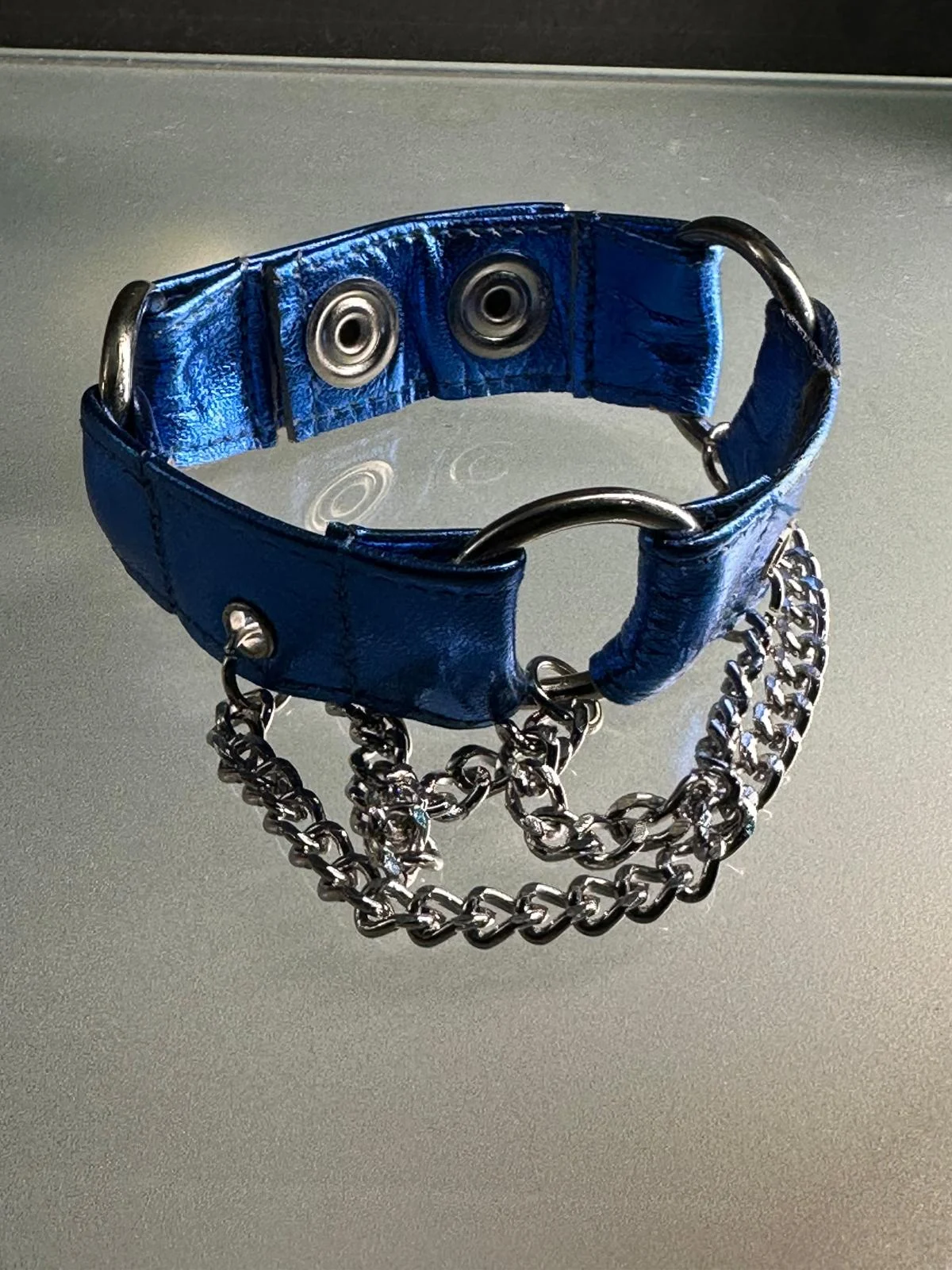 Electric sapphire blue leather cuff bracelet with dark silver hardware and chains