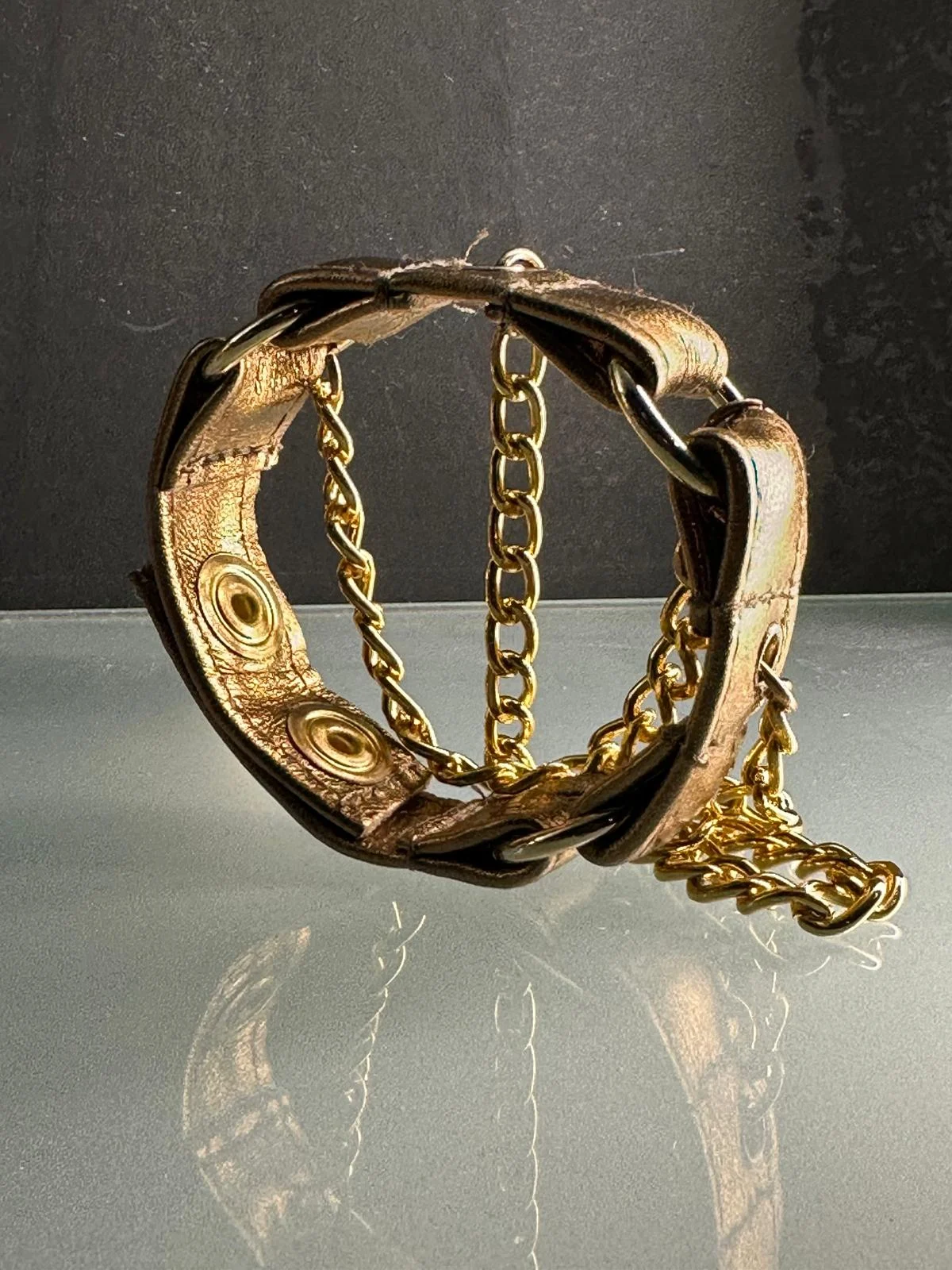 Metallic copper leather bracelet with gold hardware and draped chains – view 3