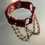Crimson red leather chain bracelet with gold-tone chains and O-rings