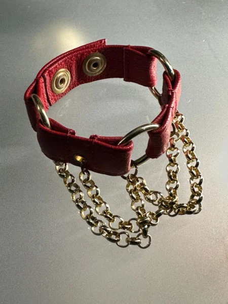 Crimson red leather chain bracelet with gold-tone chains and O-rings