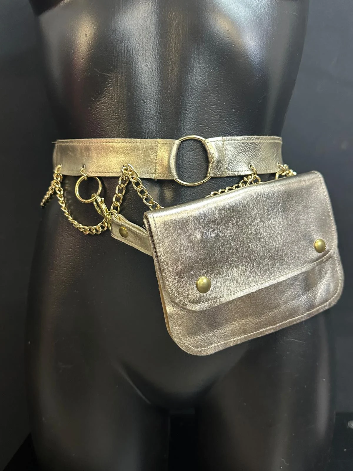 Golden Aura metallic gold leather belt bag with gold-tone chains and circular hardware