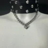 Black leather choker necklace with silver studs, steel chain and heart charm