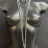 Iridescent orchid leather body chain with layered silver chains and center ring